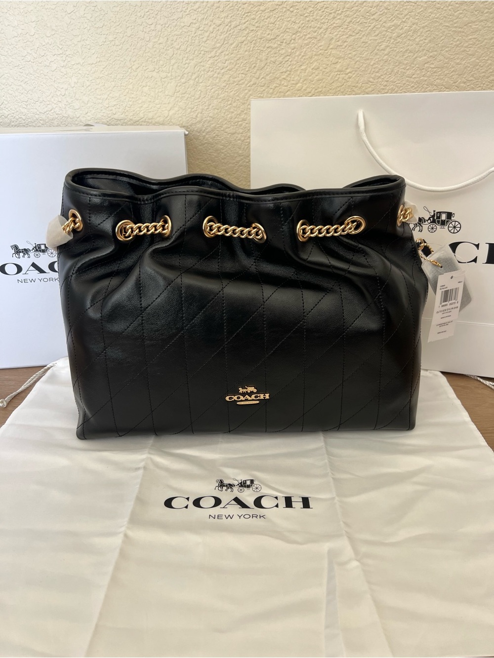 COACH NWT Evelyn Shoulder Bag
With Quilting (Full Inclusion)